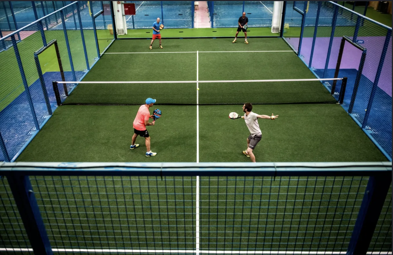 Doubles match in full energy on a premium indoor padel court